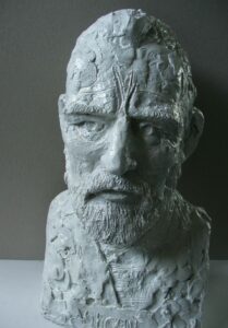 A white Vincent Bust of a man with a beard, crafted by artist and master sculptor Robert C Hitchcock. Bronze Sculpture by Artist and Master Sculptor Robert C Hitchcock