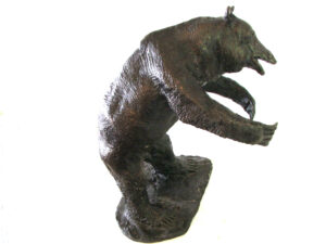A bronze Bear Sculpture standing on its hind legs, created by renowned artist and master sculptor Robert C Hitchcock. Bronze Sculpture by Artist and Master Sculptor Robert C Hitchcock