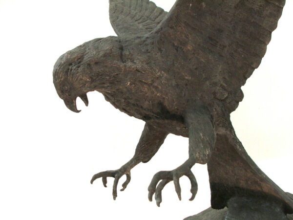 A captivating bronze sculpture of the Bird of Prey skillfully crafted by artist Robert C Hitchcock, a master sculptor. Bronze Sculpture by Artist and Master Sculptor Robert C Hitchcock