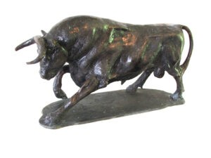 A Bull Sculpture created by Master Sculptor Robert C Hitchcock depicting a bull running on a white background. Bronze Sculpture by Artist and Master Sculptor Robert C Hitchcock