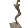 A bronze sculpture of a man in a pose created by artist and master sculptor Abstract Lady. Bronze Sculpture by Artist and Master Sculptor Robert C Hitchcock