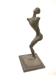A bronze sculpture of a man in a pose created by artist and master sculptor Abstract Lady. Bronze Sculpture by Artist and Master Sculptor Robert C Hitchcock