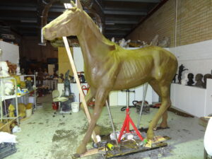 A stunning bronze sculpture of a Life-Size Horse created by the talented artist and master sculptor Robert C Hitchcock in his workshop. Bronze Sculpture by Artist and Master Sculptor Robert C Hitchcock
