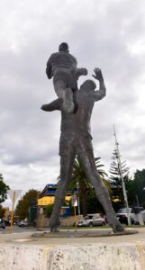 A statue of a man holding another man.