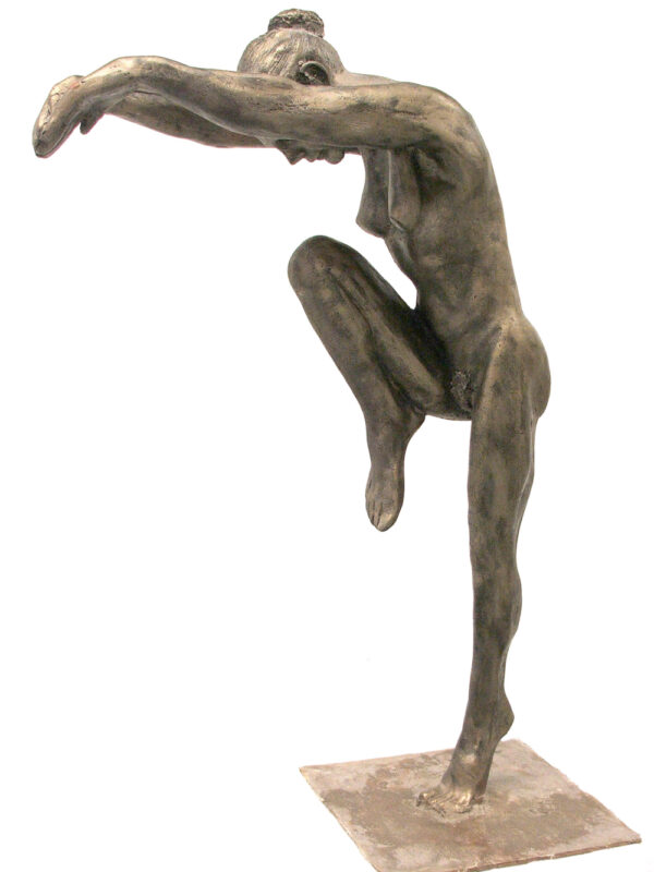 A bronze statue of a woman in a pose.