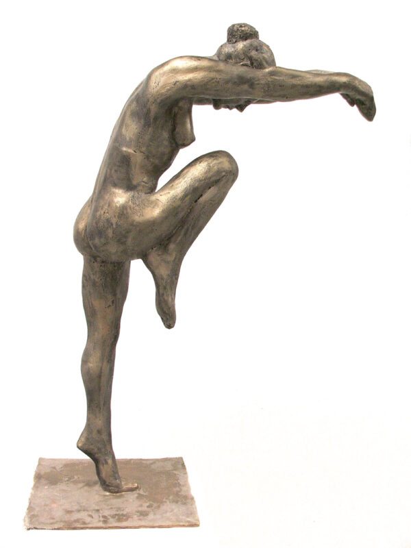 A bronze sculpture of a woman in a pose.
