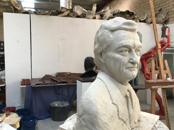 A bronze sculpture of a man in a studio, created by master sculptor Bob Hawke. Bronze Sculpture by Artist and Master Sculptor Robert C Hitchcock