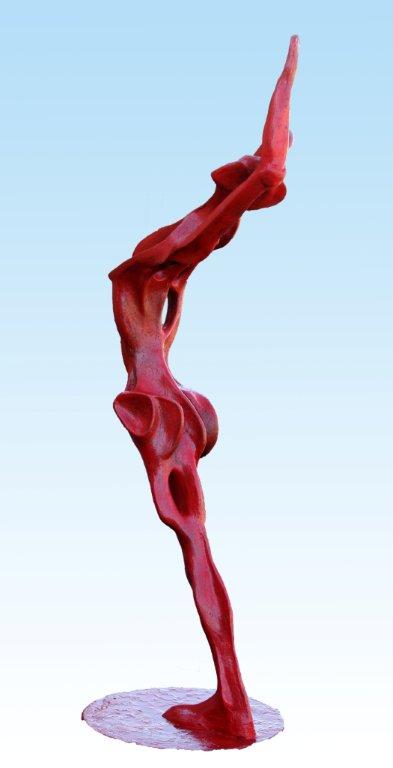 A red sculpture of a dancer on top of a pedestal, depicting the majestic Red Bather.