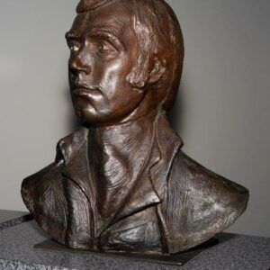 Bronze sculpture of a male figure on a pedestal. Sculptor - Robert C Hitchcock