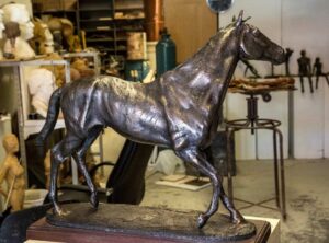 A bronze Northerly sculpture crafted by master sculptor Robert C. Hitchcock in his workshop.